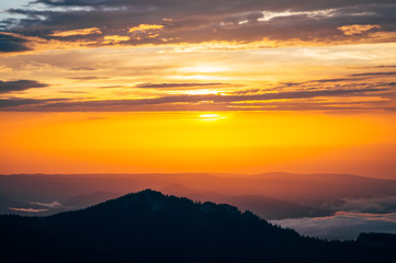 Background of Sunset Sky and Mountains clouds beautiful scenery with natural colors Landscape Travel concept aerial view