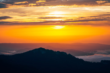 Obraz premium Background of Sunset Sky and Mountains clouds beautiful scenery with natural colors Landscape Travel concept aerial view