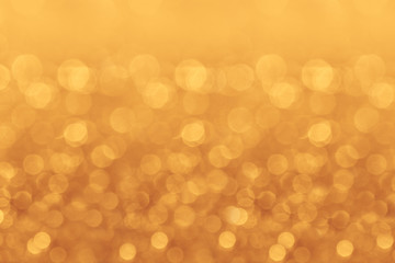 Christmas bokeh background. Golden background with blurred lights.