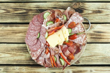 snack on a wooden tray on a wooden background
