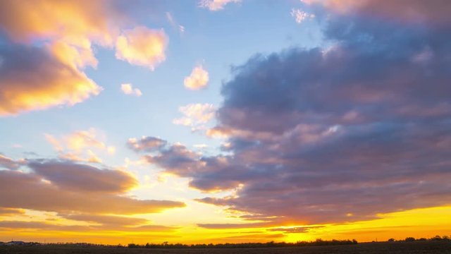 Sunset Sky over the Field. Time Lapse. 4K 
