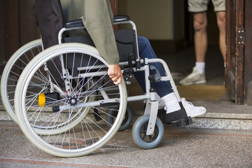 closeup of woman in wheelchair at an entrance