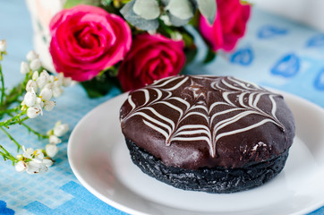 Chocolate donut with web pattern