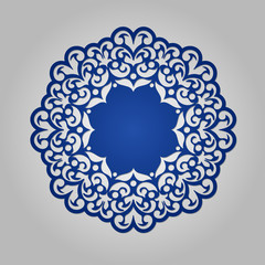 Die cut paper card with cutout mandala ornament.