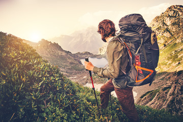 Man Traveler with backpack mountaineering Travel Lifestyle concept lake and mountains on background...