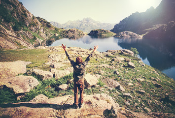 Man Traveler yoga relaxing alone hands raised Travel healthy Lifestyle concept lake and mountains serene landscape on background outdoor