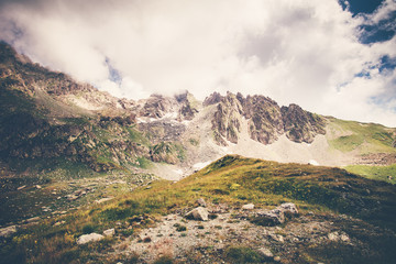 Rocky Mountains and clouds Landscape in Abkhazia Summer Travel serene scenic view.