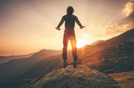 Young Man Flying levitation jumping in sunset mountains Lifestyle Travel concept outdoor © EVERST