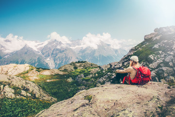 Woman Traveler with backpack relaxing with mountains serenity view Travel Lifestyle concept hiking adventure summer vacations