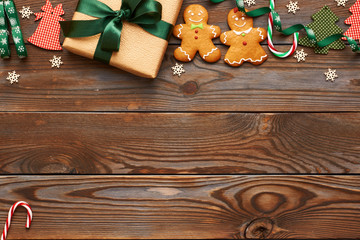 Christmas present and decoration on wooden background