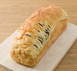 Raisin Bread on A Wooden Cutting Board