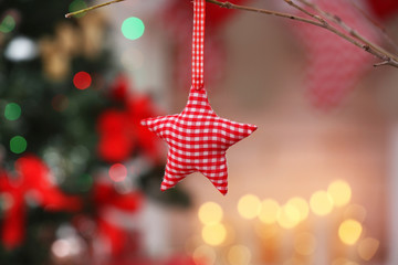 Checkered decorative star on blurred background, close up view