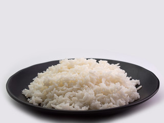 bowl full of rice on white