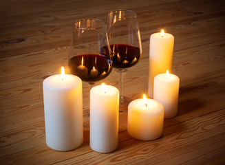 Fototapeta na wymiar Wine with candles on wooden background