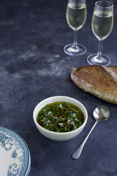 Italian Style Salsa Verde served with bread and white wine. Phot