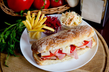 Sandwich with fries and salad
