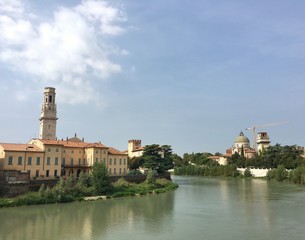 VERONA, ITALY - SEPTEMBER 3, 2016 : cityscape of the old town of Verona and its river during summer