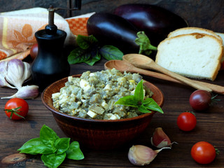 Appetizer of eggplant and eggs flavored with garlic and basil. Vegetable caviar.