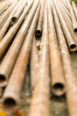 Metal pipes are stored at the factory warehouse