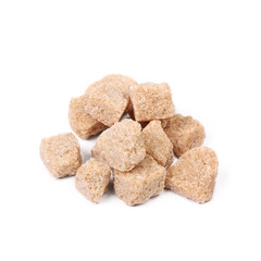 Raw cane brown sugar cubes isolated over white