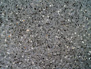 Obraz premium dark gray concrete mixed small marble fragments and gravel stone, interior bathroom tiles floor