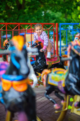 children ride roundabouts