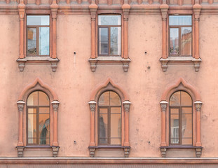 Fototapeta na wymiar Several windows in a row on facade of St. Petersburg Medical Center front view, Russia.