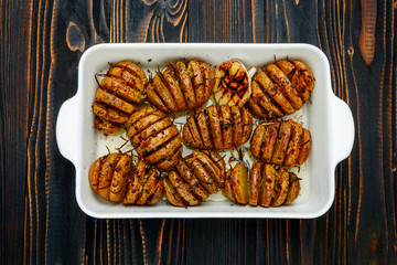 Baked spicy potatoes in baking dish