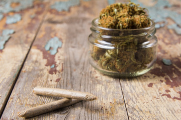 Marijuana buds in the glass pot