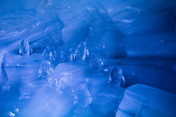 Penguin sculpture in ice cave in Swiss Alps glacier