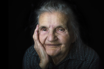 Portrait of a nostalgic elderly woman. Evoking the past.