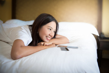 Obraz na płótnie Canvas Asian woman using smartphone on bed,Woman enjoy shopping online