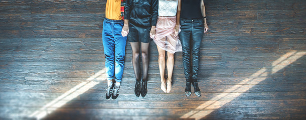 Top view of people feet lying on floor © Yakobchuk Olena