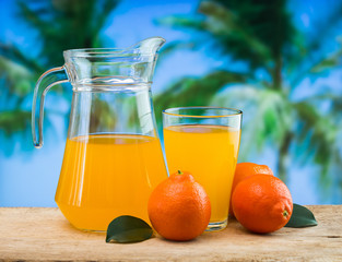 orange juice in a glass on a table