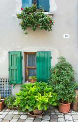 Window in an old house decorated with flower