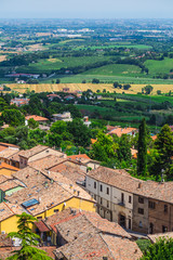 landscape with roofs of houses in small tuscan town in province