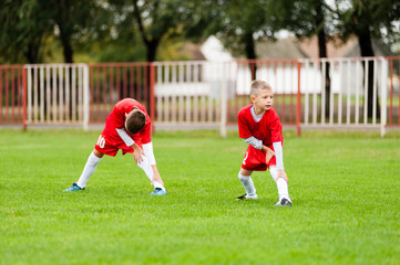 Young soccer warming up for the match