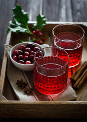 Mulled wine with cranberries, anise stars and cinnamon sticks