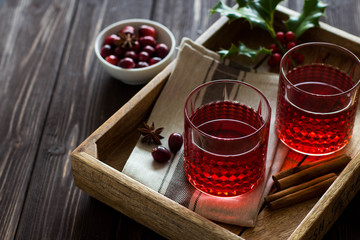 Mulled wine with cranberries, anise stars and cinnamon sticks