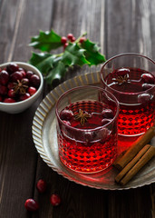 Mulled wine with cranberries, anise stars and cinnamon sticks