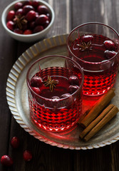 Mulled wine with cranberries, anise stars and cinnamon sticks