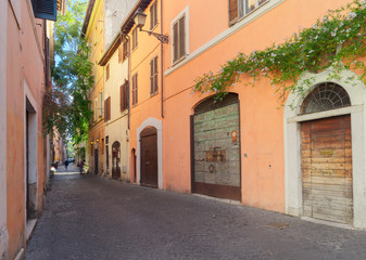 Fototapeta na wymiar old town italian street in Trastevere, Rome, Italy