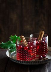 Mulled wine with cranberries, anise stars and cinnamon sticks