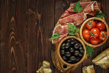Plate with snack - prosciutto, jamon, ham.
