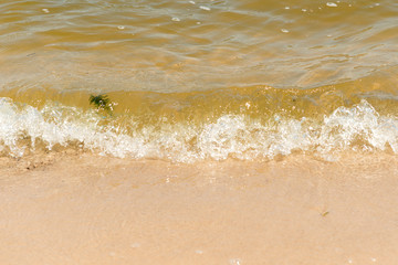 Fototapeta na wymiar Summer vacation at the beach. Golden sand. Tidal bore.