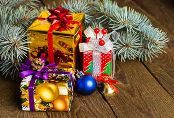 Christmas presents with christmas decorations on wooden backgrou