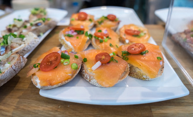 canapes with salmon and tomato cherries for sale