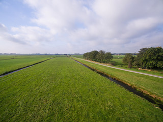 Fototapeta na wymiar aerial view of green geometric agricultural fields in Netherlands