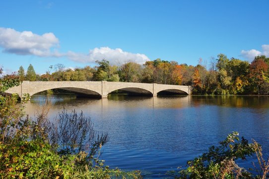 Fall foliage over the Washington Bridge on Lake Carnegie in Princeton, New Jersey