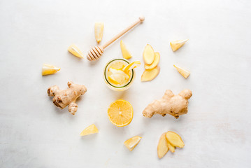 Ginger-lemon drink in a bottle with a straw. Selection of the ingredients of ginger cocktail or...